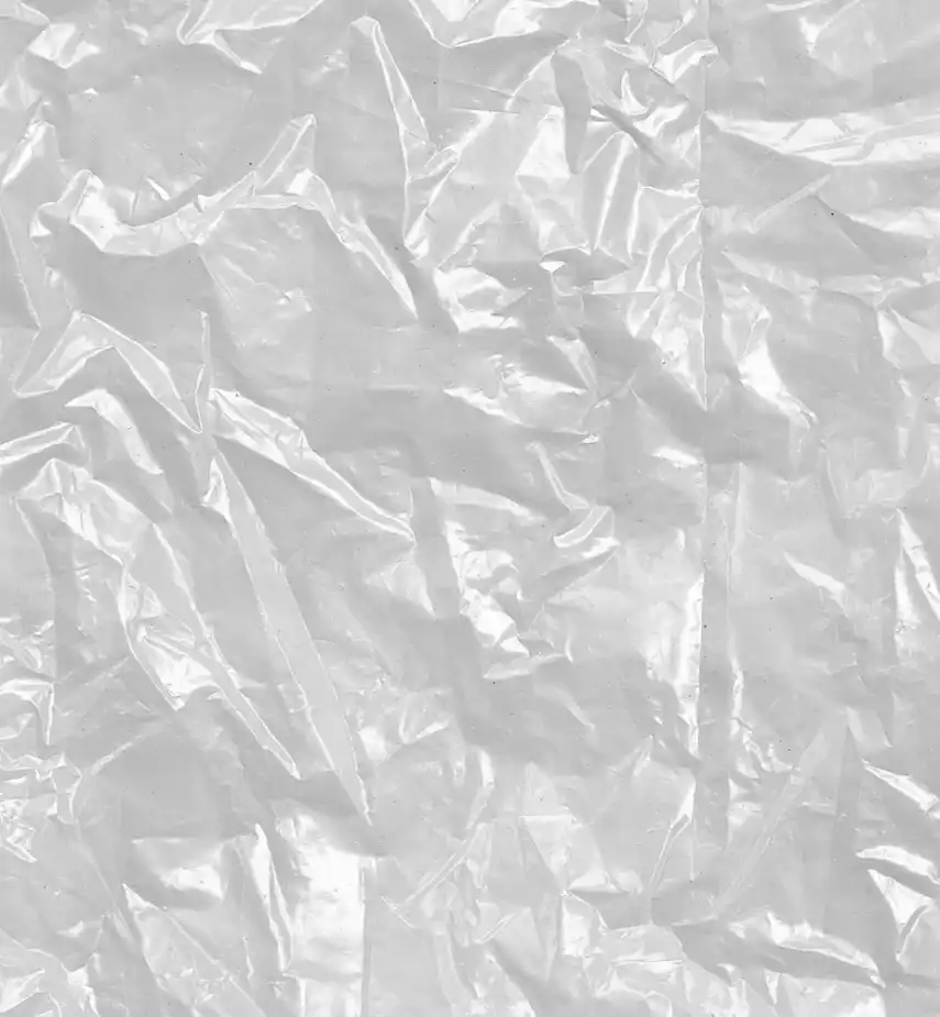 Crumpled white plastic or cellophane material with wrinkles and folds.