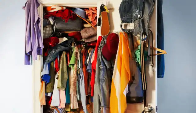 Overfilled closet with various clothes