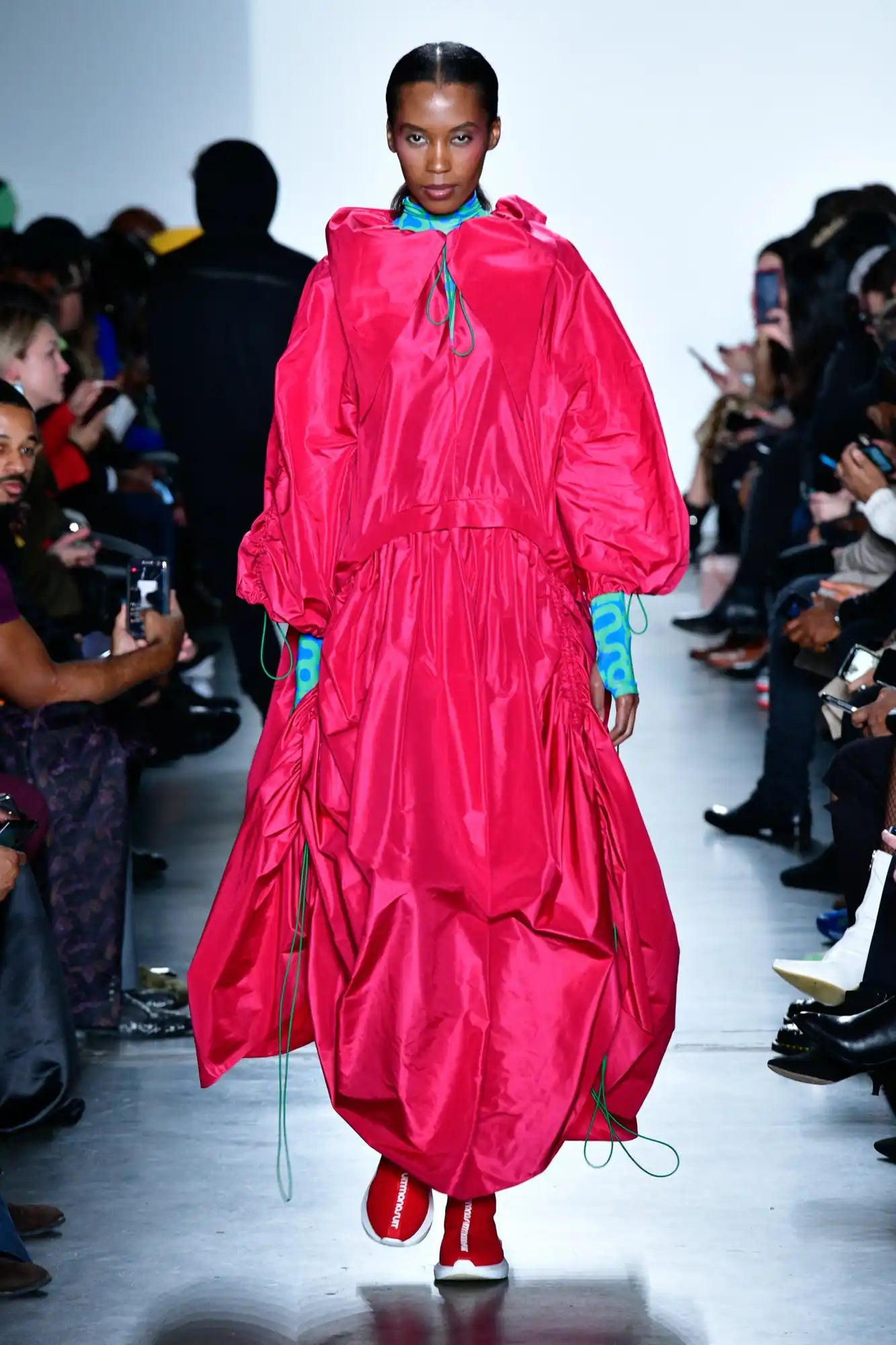 Vibrant hot pink balloon-style dress with gathered tiers, puffy sleeves and drawstring details.